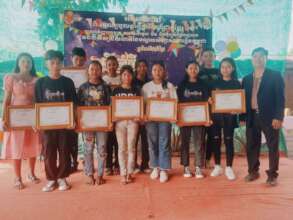 Students receive certificates of Spelling Bee