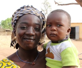 A mother smiles with her recently-vaccinated child