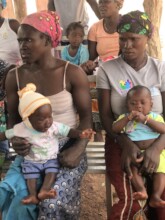 Two Mothers With Their Vaccinated Children