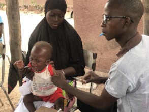 Doctor Prepping Child For Vaccination