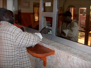 Villager repaying loan in Ouelessebougou