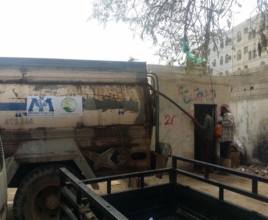 Ahmad retrieves water from our water truck