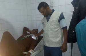 Mohammad treating a wounded patient