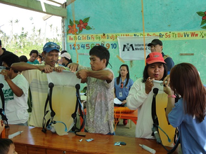 Villagers using the Waterbag
