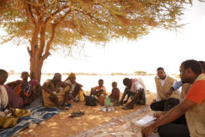 Our staff speaks with villagers about their health