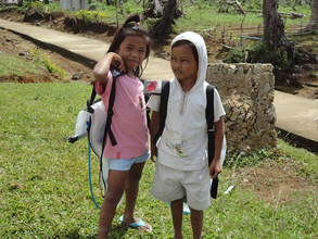 Children carrying Waterbags