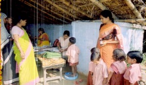 Children being weighed at a health camp