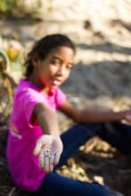 Isha planting seeds.