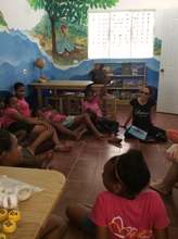 Julia Alvarez volunteering with girls in Library
