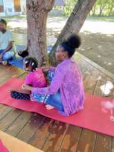 Wisminia and her mom, Fifi, practicing yoga