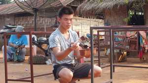 One the younger residents painting the frames