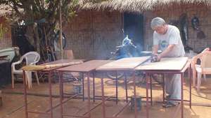 The camp head man showing off his carpentry skills