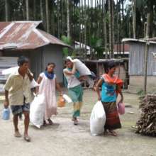 Family carrying the MY Pads to their home