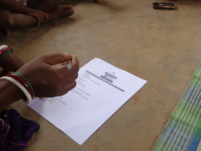 A lady filling out the survey form