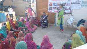 Women being educated to make their own cloth pad