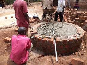 Installing drainage and outlet water pipes in base