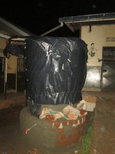 Covering plastered tank to cure for five days