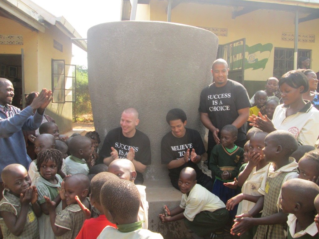 Kids using water from the tank