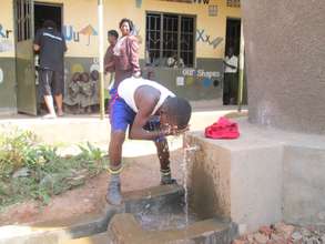 A pupil using up tank water