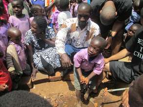 Kids using water from the tank