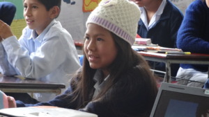 Carla in classroom listening atentively