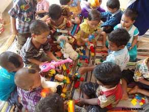 Engaged in playing with toys..