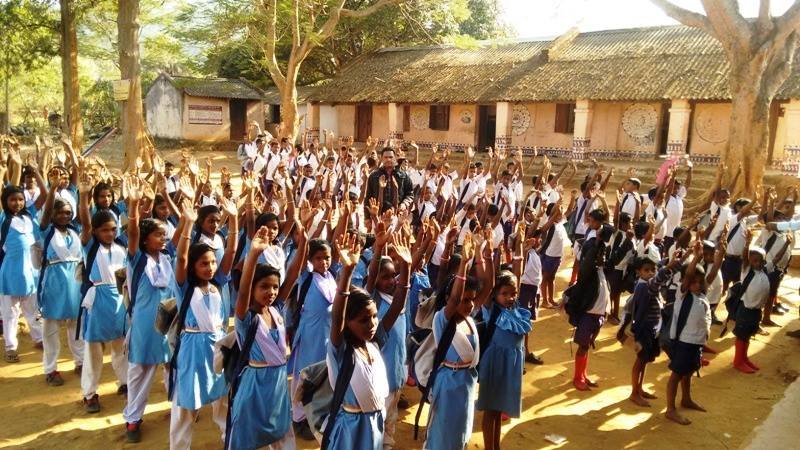 Children excited with school kits..