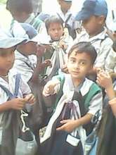Girl child with her school kit..