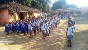 Children happy to get their school kits