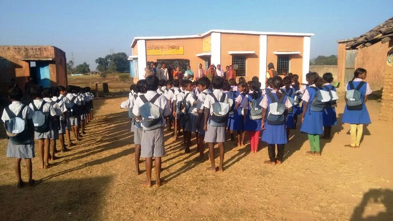 Children with their school kits