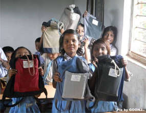 Showing their school kits...