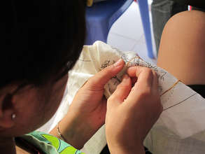 Concentrating deeply in the intricate needle work
