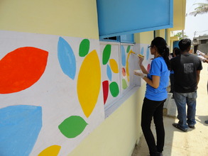 Corporate volunteers paint the signature BL design