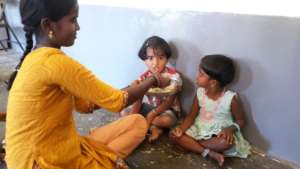 Mother feeding children