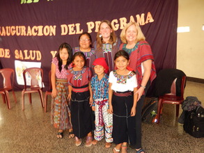MM Staff in "huipiles" Presented by the Children