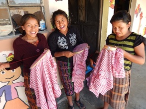 Nitke and her classmates with their embroidery