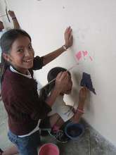 Nitke working on her school mural