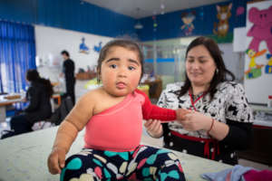 A  tiny patient receives compression garments!