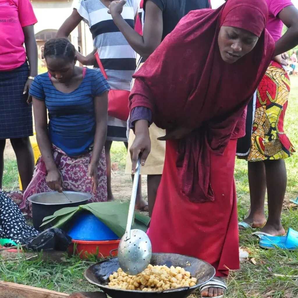 Girls learn to make snacks for selling in Kyetume
