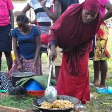 Girls learn to make snacks for selling in Kyetume