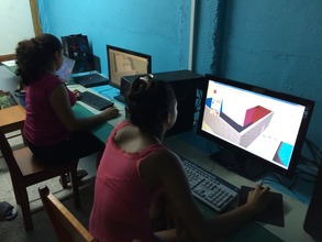 Girls learning to make 3-D building designs