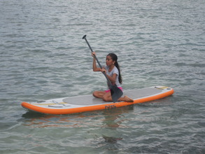 Lilly paddle boarding