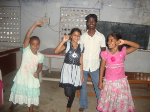 Murali dancing with other children