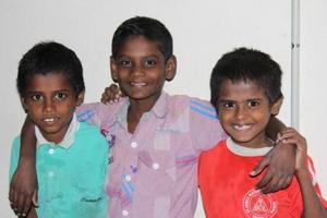 Anbarasan (centre) with friends in New Life's home