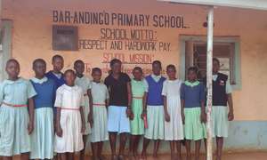 Bella (center) with primary school girls