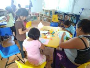 Parents working with their children