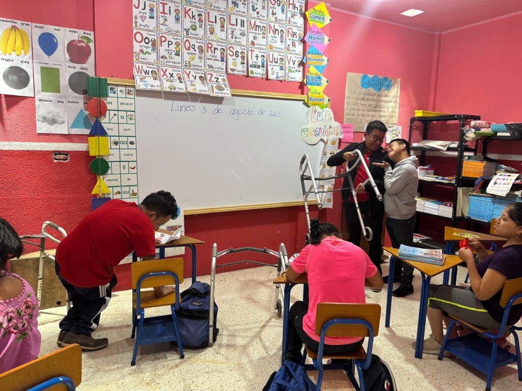Gaspar helping in the school