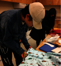 A student from Elgin Park making reusable pads.