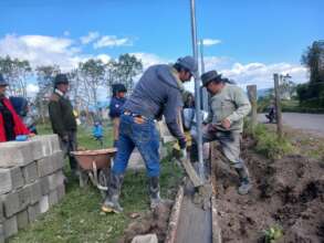 Building a wall around the school in Ecuador