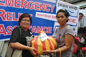 Our local partner with a beneficiary
